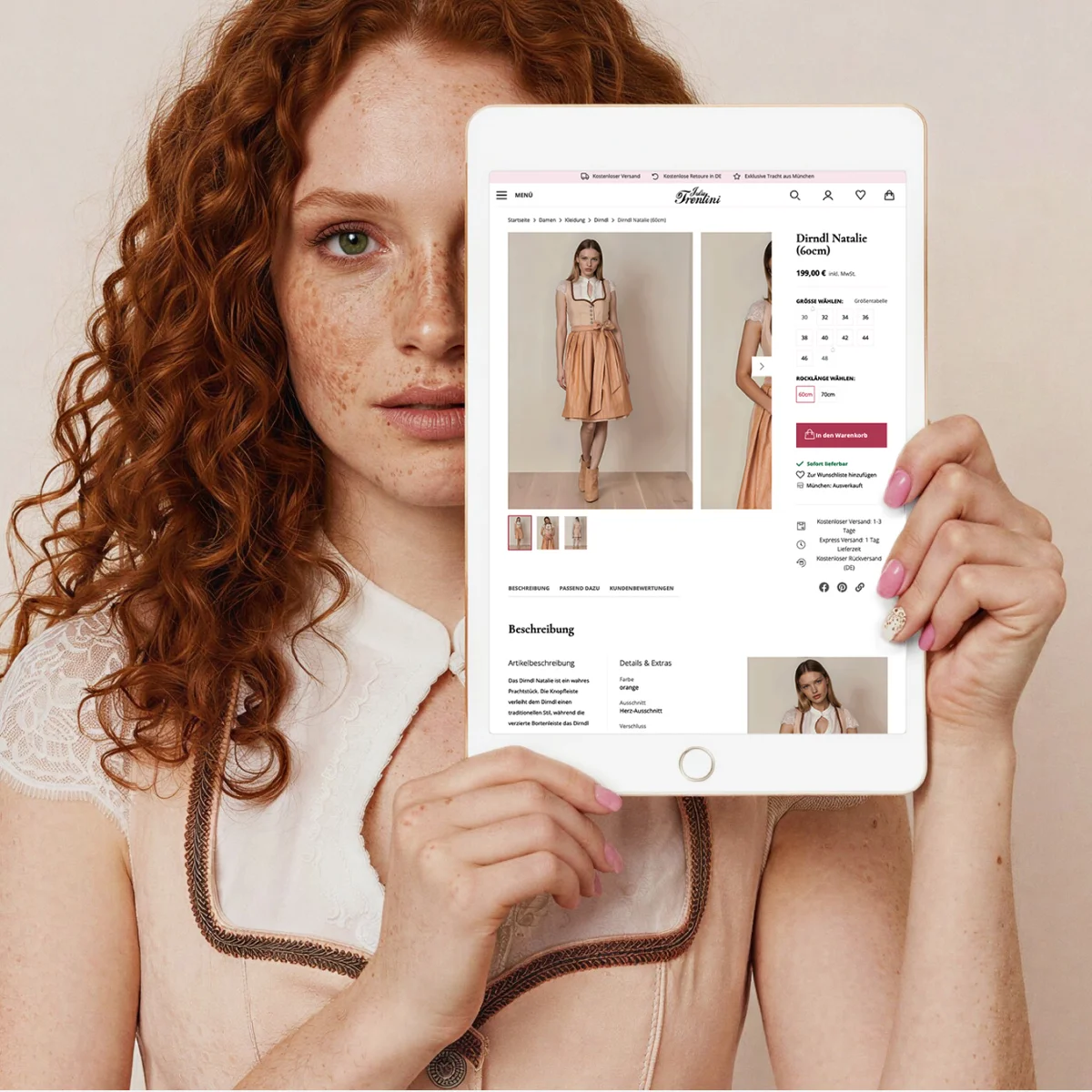 Julia Trentini E-Commerce-Vorschau auf einem Tablet mit exklusiver Trachtenmode, präsentiert von einem Modell im passenden Dirndl