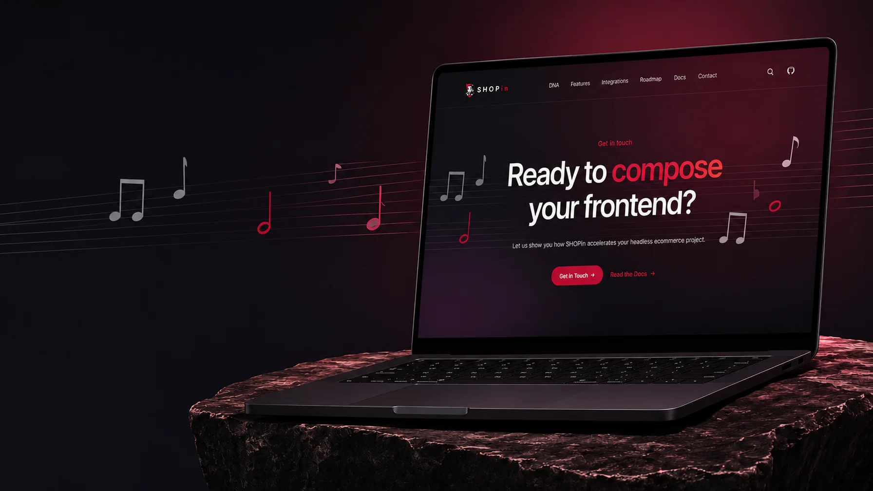 Laptop on a textured surface displaying a website with "Ready to compose your frontend?" slogan and musical notes in the background.