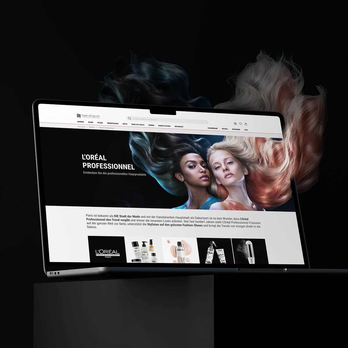 haar-shop.ch E-Commerce-Website-Vorschau auf einem Laptop mit der Markenseite von „L'ORÉAL PROFESSIONNEL“, einer dramatischen visuellen Darstellung von Models und fließendem, farbenfrohem Haar vor einem dunklen Hintergrund mit künstlerischen Haarteilen