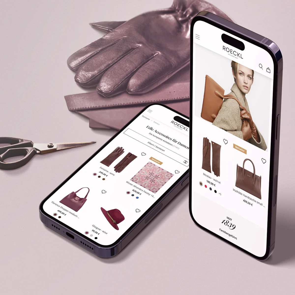 Roeckl E-Commerce-Website-Vorschau auf zwei Mobilgeräten mit eleganten Lederhandschuhen und Handtaschen neben hochwertiger Produktfotografie